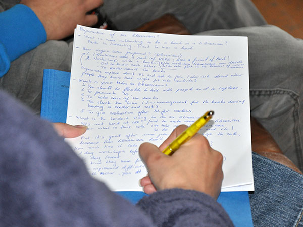 Participant taking notes