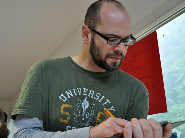 Sven taking notes at project exhibition