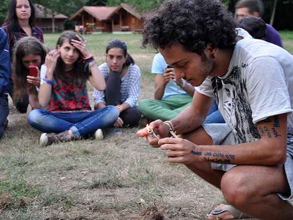 Giuseppe lights the fire